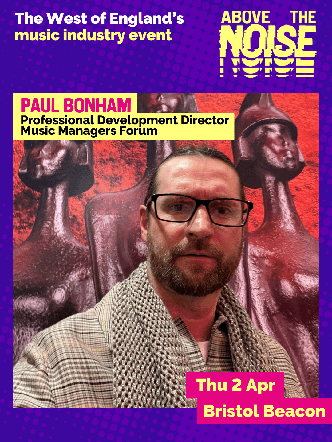 Paul Bonham - Professional Development Director, Music Managers Forum. Thu 2 Apr, Bristol Beacon. A person with slicked back hair, a trimmed beard, black glasses and a plaid-print smart jacket poses in front of three red statues.