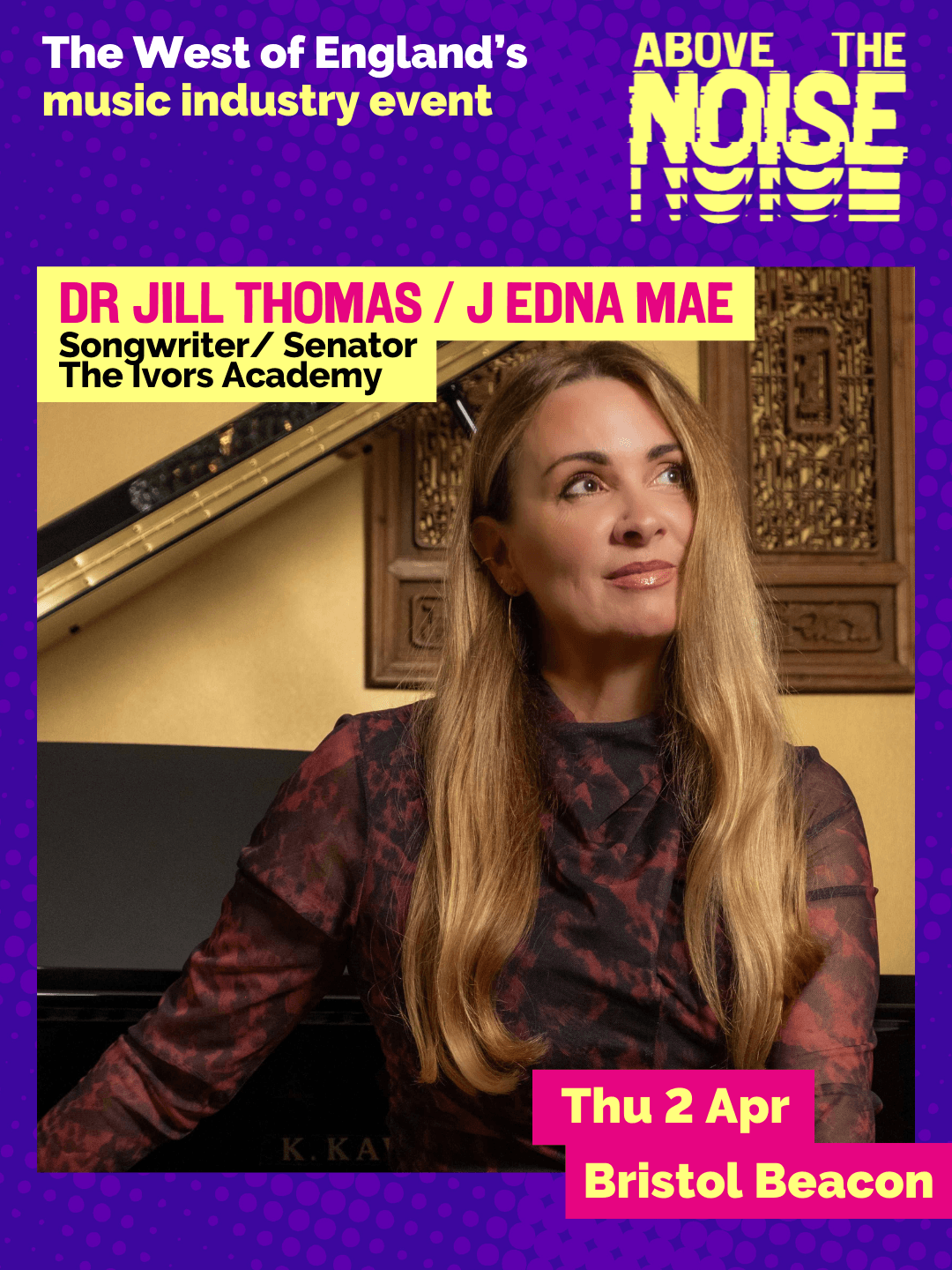 Dr Jill Thomas / J Edna Mae - Songwriter / Senator, The Ivors Academy. Thu 2 Apr, Bristol Beacon. A person with long blonde hair wearing a ruby red formal gown poses in front of a piano.