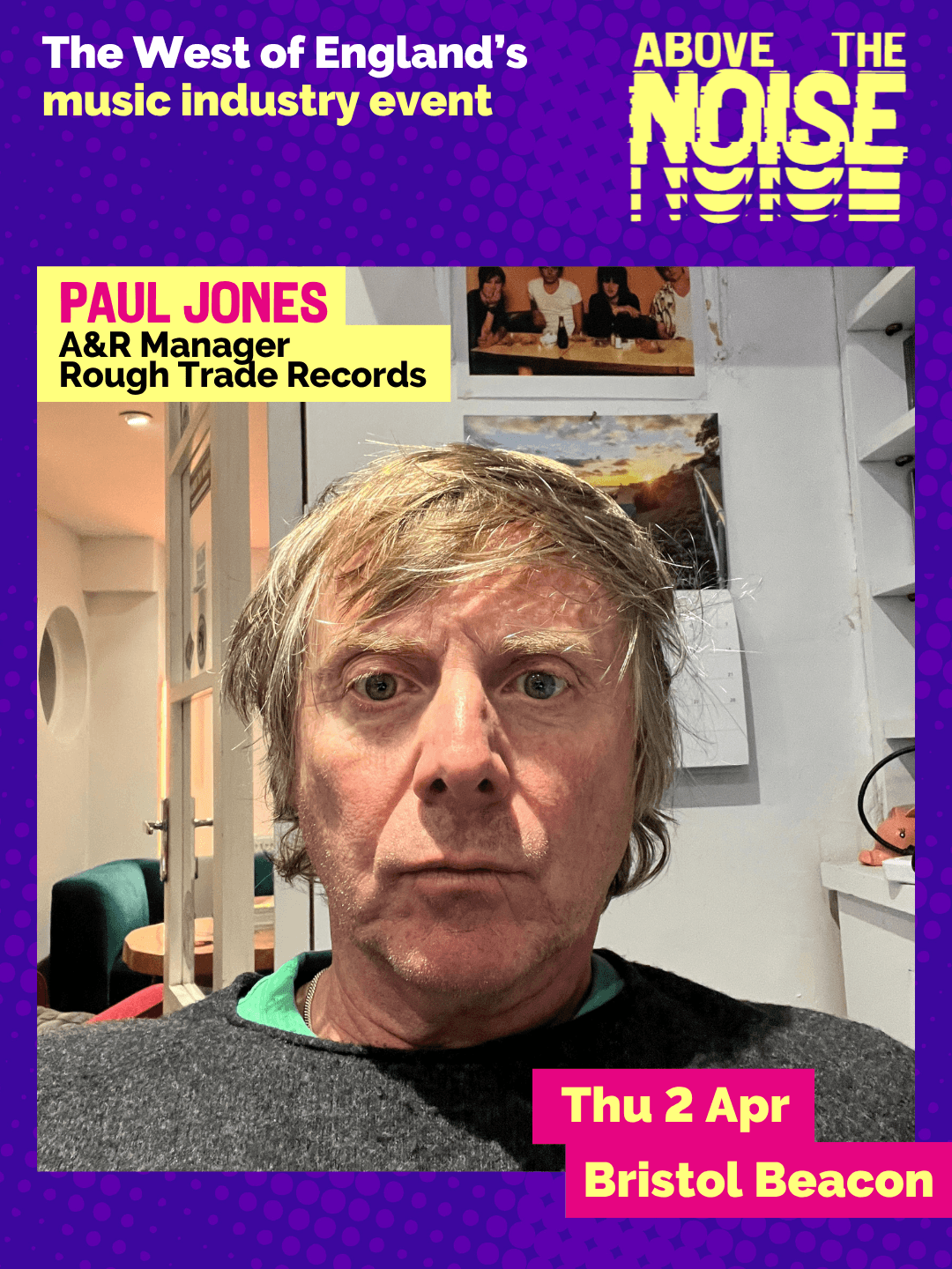 Paul Jones - A&R Manager, Rough Trade Records. Thu 2 Apr, Bristol Beacon. A person with shaggy, mid-length hair wearing a dark grey jumper poses in an office, surrounded by shelves and a calendar.